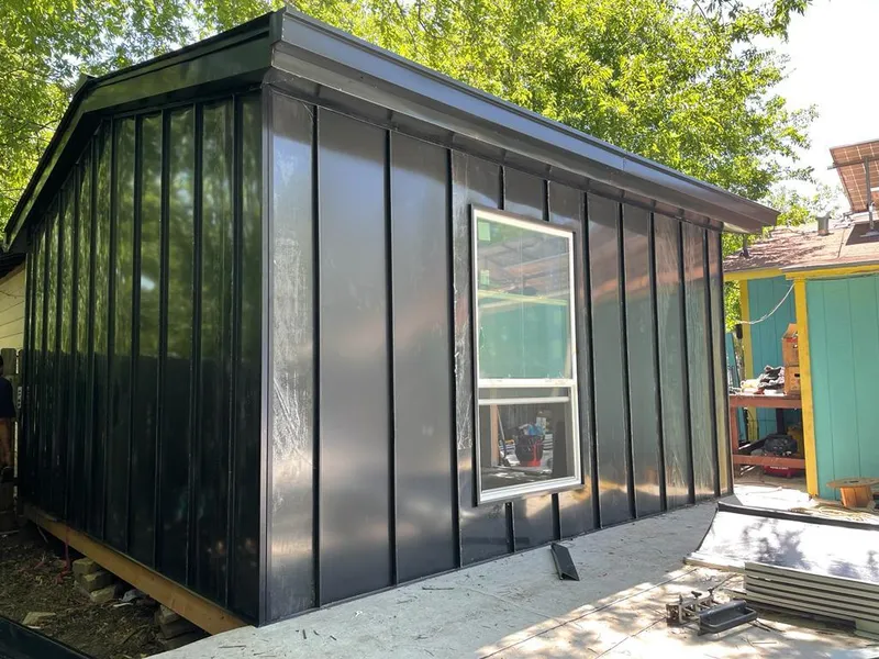 Black standing seam metal wall panels for Metal Roof Installation in New London